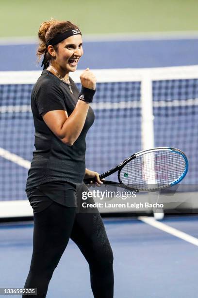 Sania Mirza of India celebrates during the second set of her quarterfinal doubles match against Shuai Zhang of China and Lucie Hradecká of Czechia...