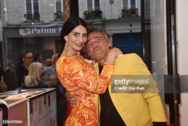 Model Sylvie Ortega Munos and Luigi di Donna attend "Le Petit Echo De L'Art Et De La Mode" Auction Party At 12 ND Nazareth on August 26, 2021 in...