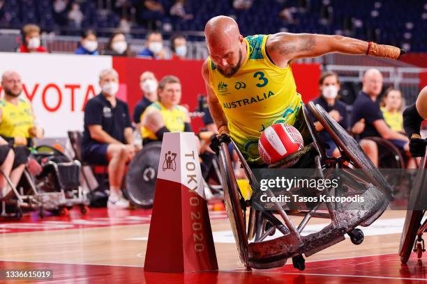 Ryley Batt of Team Australia fight for the ball against Team Japan in group A wheelchair rugby match two on day 3 of the Tokyo 2020 Paralympic Games...