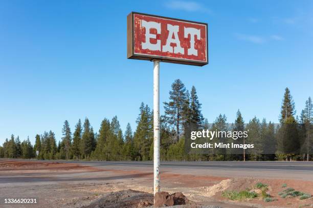 retro style eat sign at a roadside café - woodland cafe stock pictures, royalty-free photos & images