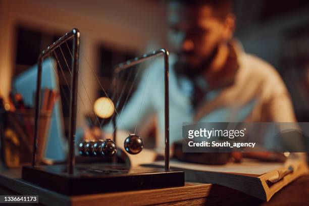 male writer a new novel - newtons cradle stock pictures, royalty-free photos & images