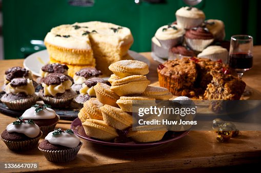Selection of homemade rustic baked goods such as sweet pies and cupcakes Selection of homemade rustic baked goods such as sweet pies and cupcakes