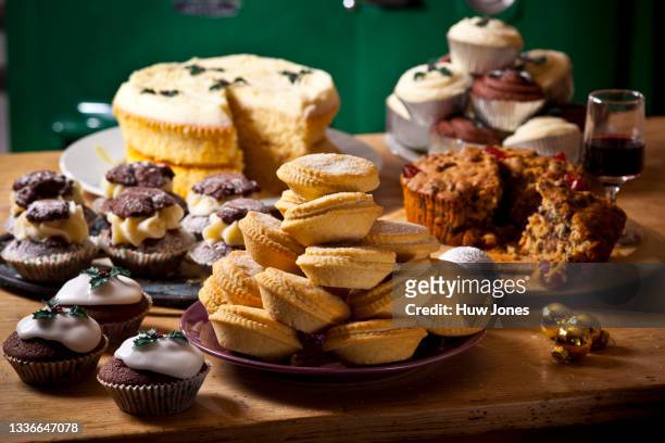 selection of homemade rustic baked goods such as sweet pies and cupcakes - cake table stock pictures, royalty-free photos & images