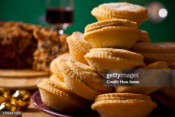 close up stack of homemade rustic mince pies - mince pie stock pictures, royalty-free photos & images