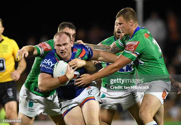 Matt Lodge of the Warriors is tackled during the round 24 NRL match between the New Zealand Warriors and the Canberra Raiders at BB Print Stadium, on...