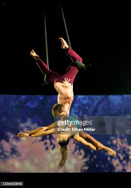 Cast members perform during the grand reopening of "The Beatles LOVE By Cirque du Soleil" at The Mirage Hotel & Casino on August 26, 2021 in Las...