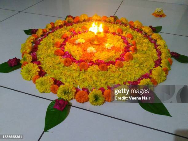 onam pookalam/floral pattern/onam festival/kerala - pookalam stock pictures, royalty-free photos & images