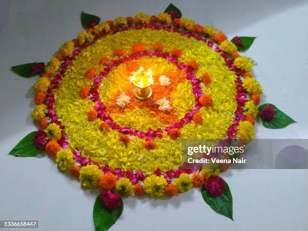 onam pookalam/floral pattern/onam festival/kerala - pookalam stock pictures, royalty-free photos & images