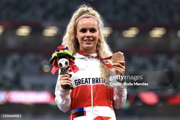 Maria Lyle of Team Great Britain celebrates with the bronze medal during the medal ceremony for the Women's 100m - T35 Final on day 3 of the Tokyo...