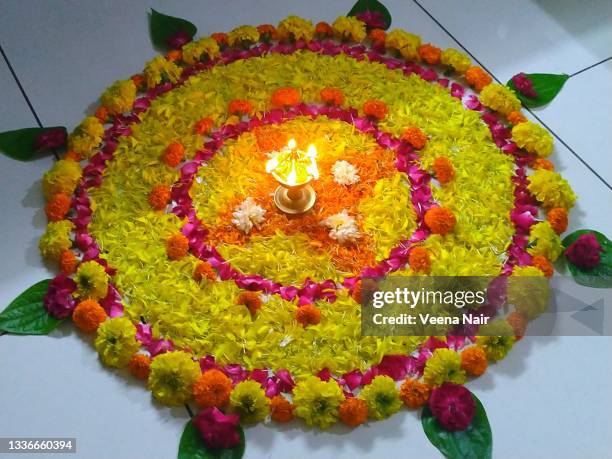 onam pookalam/flower rangoli/floral pattern/onam festival/kerala - pookalam stock pictures, royalty-free photos & images