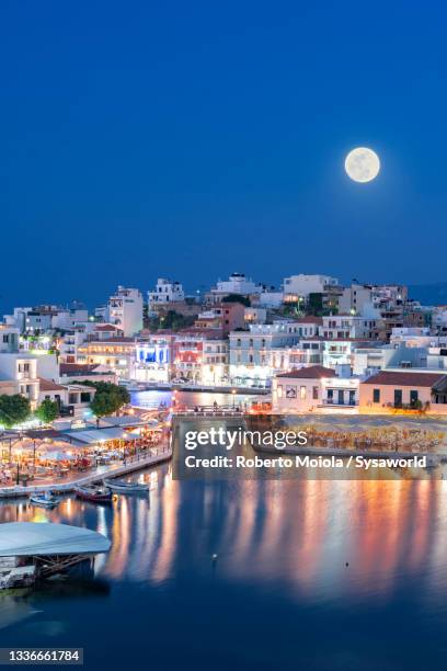 moonlight at dusk on agios nikolaos, crete, greece - greece city bildbanksfoton och bilder