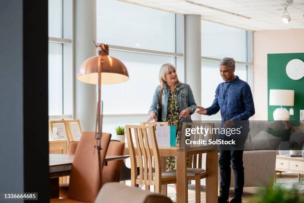 building a home together - luxury home dining table people lifestyle photography people stock pictures, royalty-free photos & images