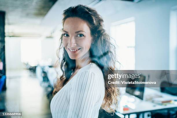 smiling businesswoman at work - boss over shoulder stock pictures, royalty-free photos & images