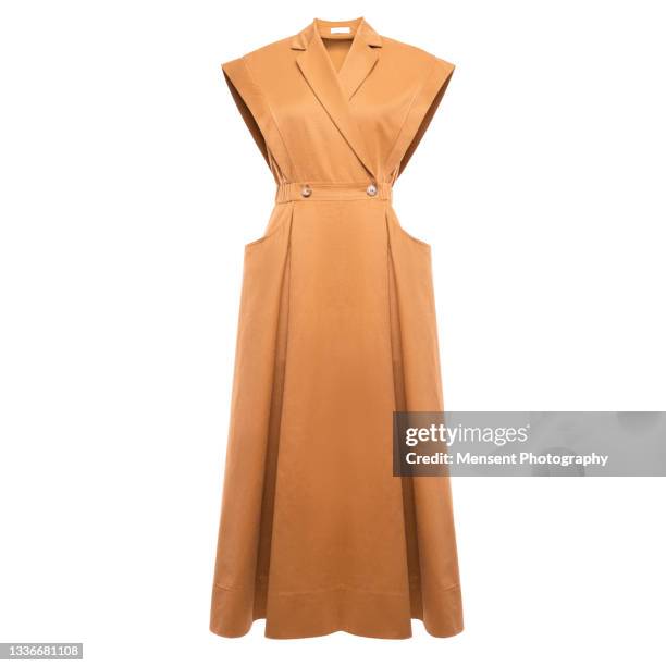 women's fashionable dress isolated in white background, invisible mannequin - orange dress stock-fotos und bilder