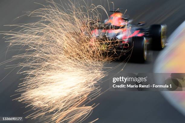 Sparks fly behind Max Verstappen of the Netherlands driving the Red Bull Racing RB16B Honda during practice ahead of the F1 Grand Prix of Belgium at...