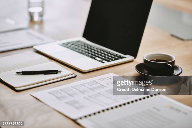 shot of a notebook and laptop in an office - notepad table stock pictures, royalty-free photos & images