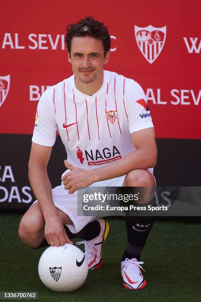Thomas Delaney poses for photo during his presentation as new player of Sevilla Futbol Club at Ramon Sanchez-Pizjuan stadium on August 27, 2021 in...