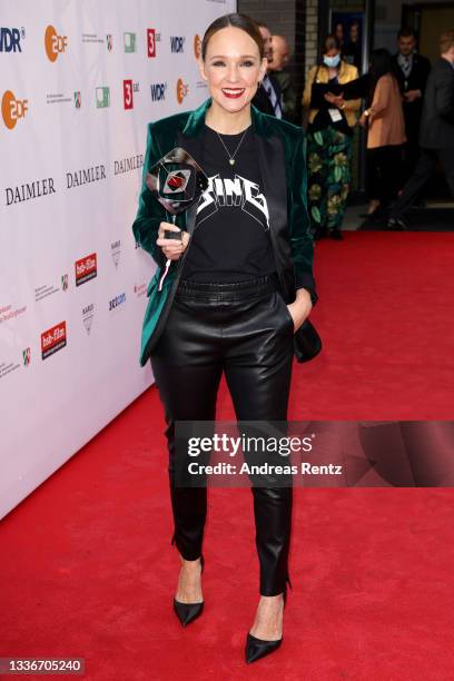 Award winner Carolin Kebekus poses with her trophy as she attends the annual Grimme Award on August 27, 2021 in Marl, Germany.