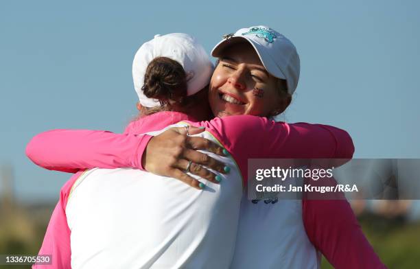 Annabell Fuller of Team Great Britain and Ireland and Hannah Darling of Team Great Britain and Ireland embrace after winning their match on the 15th...