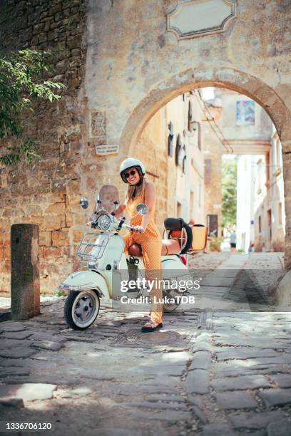 woman and her scooter - croatia tourist stock pictures, royalty-free photos & images