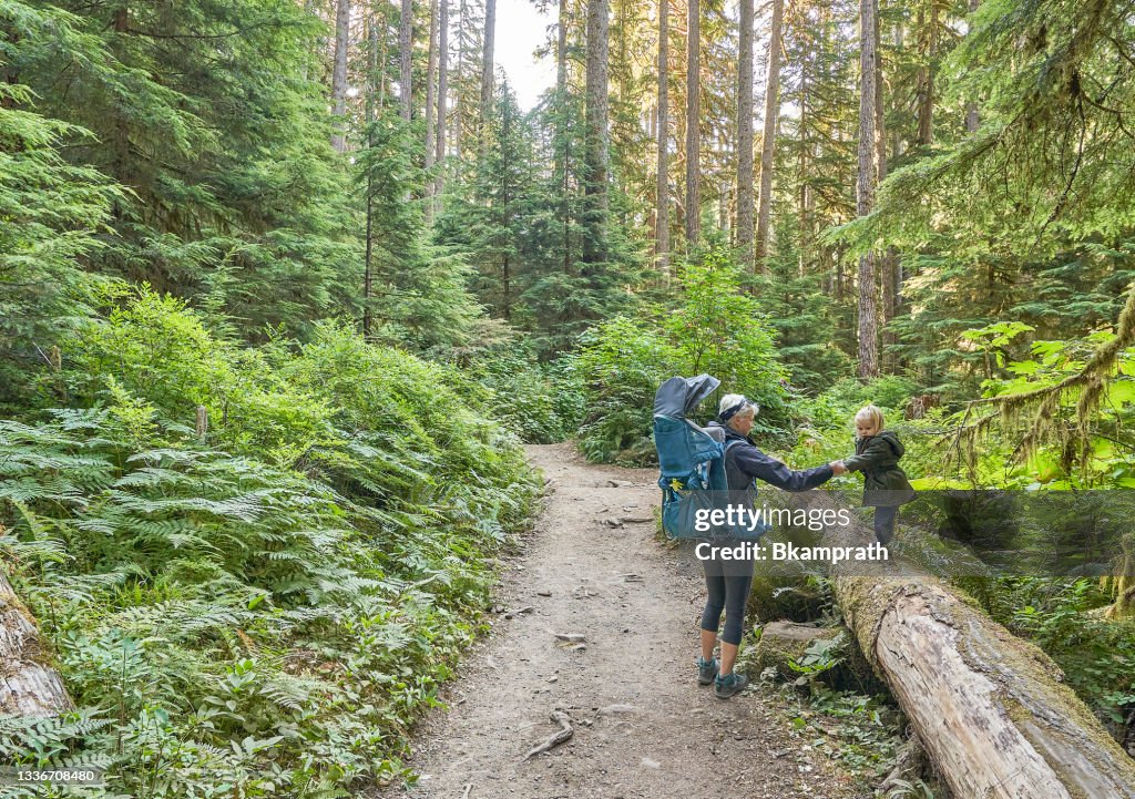 Mother and Toddler Daughter at Sol Duc Falls in the Unique Scenery of the Sol Duc River Valley in the Beautiful Olympic National Park in Western Washington State USA.
