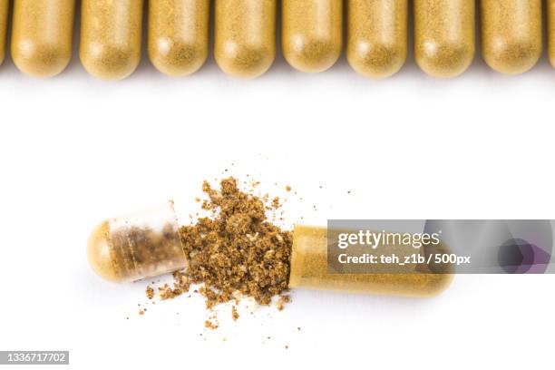 close-up of turmeric over white background - brown powder stock pictures, royalty-free photos & images