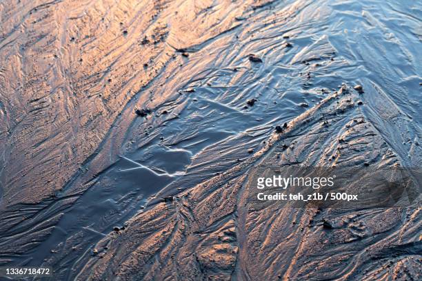 full frame shot of frozen sea - satellite tracks stockfoto's en -beelden