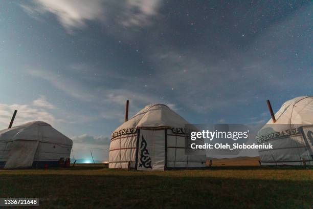 sceic view of yurt near son-kul lake at night - yurt stock pictures, royalty-free photos & images