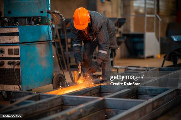 welding worker - in flames i the mask stock pictures, royalty-free photos & images