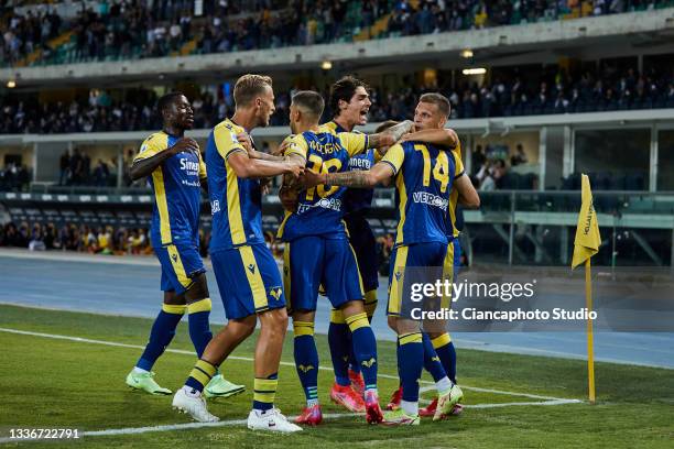 Ivan Ilic of Hellas Verona FC celebrates after scoring his team's first goal with his teammates during the Serie A match between Hellas Verona and FC...