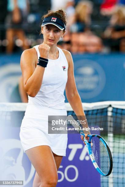 Irina-Camelia Begu of Romania celebrates after winning in the second set of her semifinal match against Magda Linette of Poland on day 6 of the...