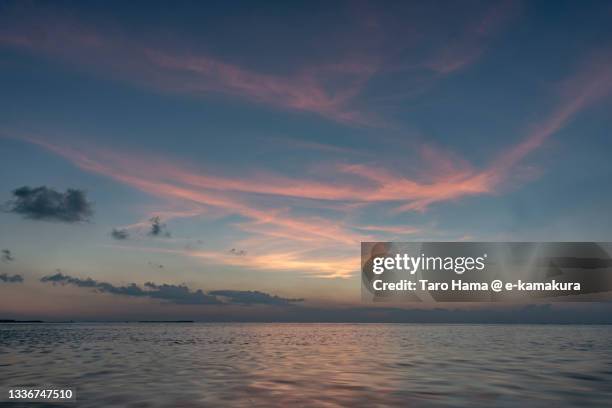 the sunset beach in okinawa of japan - coral sea stock-fotos und bilder