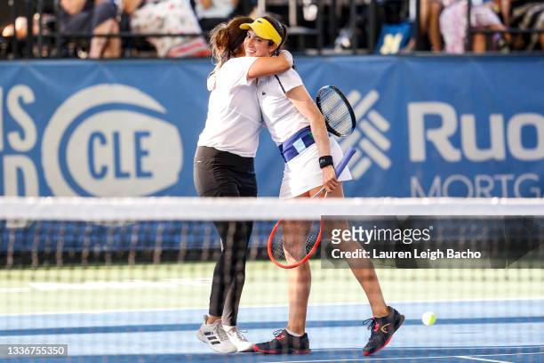 Sania Mirza of India and Christina McHale of the United States hug after winning in the second set of their semifinal doubles match against Ulrikke...