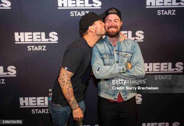 Phil Brooks “CM Punk” and Stephen Amell pose for a photo during a screening episode of the Starz channel's wrestling drama "Heels" at the AMC River...