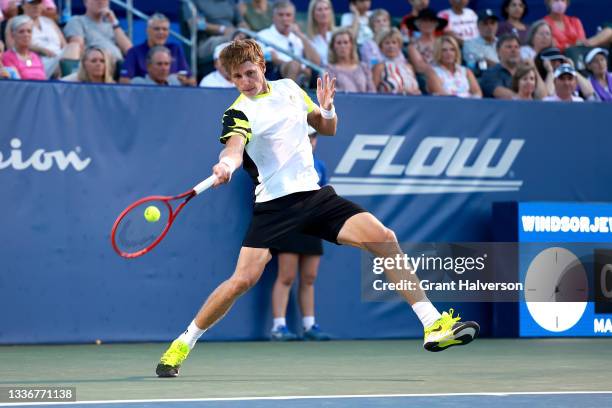 Ilya Ivashka of Belarus returns a shot to Emil Ruusuvuori of Finland during the semifinals of the Winston-Salem Open at Wake Forest Tennis Complex on...