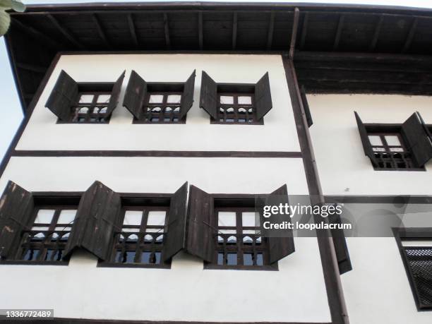 historical safranbolu wooden house windows from low angle - safranbolu turkey stock pictures, royalty-free photos & images