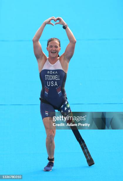 Melissa Stockwell of Team United States reacts as she crosses the finish line during the women's PTS2 Triathlon on day 4 of the Tokyo 2020 Paralympic...