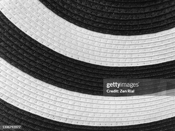 brim of a black and white ladies hat - white hat fashion item stockfoto's en -beelden