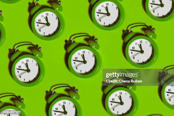 many color alarm clocks with shadows - deadline stockfoto's en -beelden