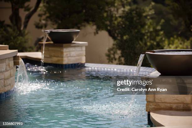 pool with water fountain bowls - outdoor water fountain stock pictures, royalty-free photos & images