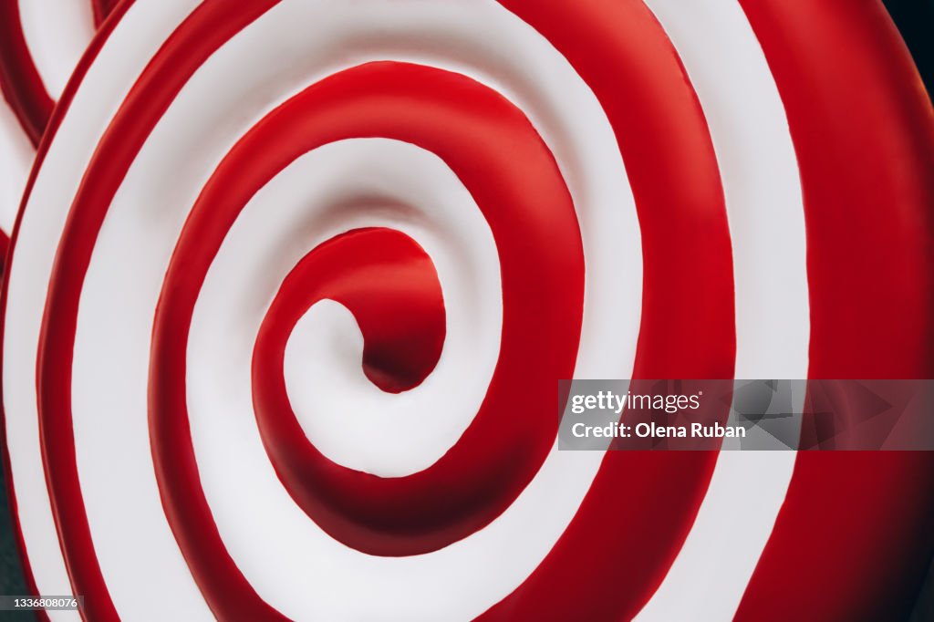 Background bright red and white lollipop closeup