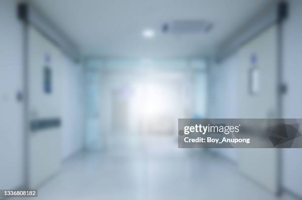 blurred image of empty corridor to operating room in hospital. - empty place setting stock pictures, royalty-free photos & images