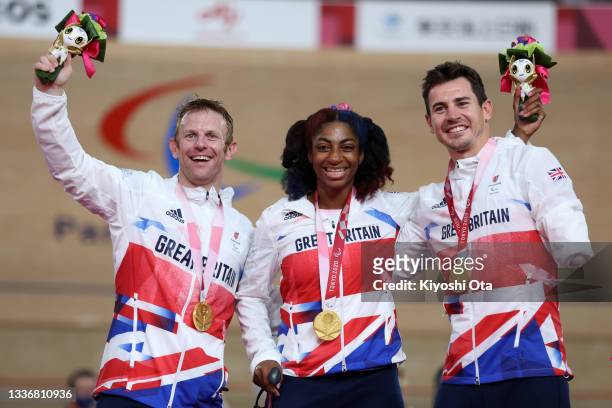 Jody Cundy, Kadeena Cox and Jaco van Gass of Team Great Britain react after winning the gold medal in the Mixed C1-5 750m Team Sprint track cycling...