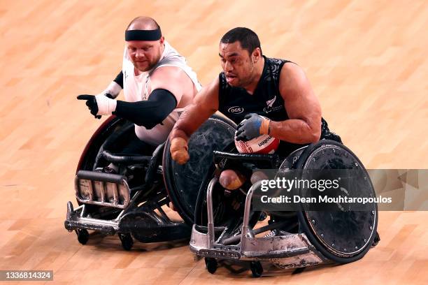 Barney Koneferenisi of New Zealand battles for the ball with Mark Ingemann Peters of Denmark during their Wheelchair Rugby 7th and 8th place play-off...