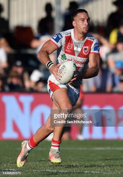 Corey Norman of the Dragons runs the ball during the round 24 NRL match between the St George Illawarra Dragons and the North Queensland Cowboys at...