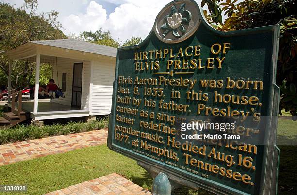Historic marker is seen next to the two-room house where Elvis Presley was born January 8, 1935 during Elvis Week August 14, 2002 in the singer's...