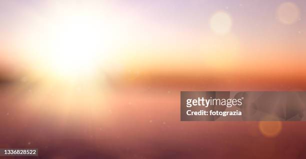 blurred landscape of a golden sunset / sunrise - light burst stock pictures, royalty-free photos & images