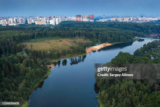 scenery of river among forest, field and residential quarter of city - krasnogorsky district moscow oblast stock pictures, royalty-free photos & images