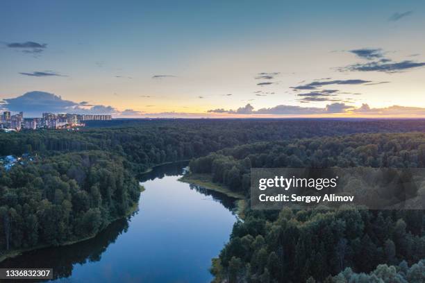 evening dawn above river and forest landscape - krasnogorsky district moscow oblast stock pictures, royalty-free photos & images