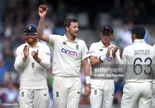 England bowler Ollie Robinson holds aloft the ball after taking his 5th wicket of the innings, Ishant Sharma during day four of the Third Test Match...